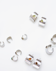 Reptilia silver earcuff with natural gemstone, close-up front view.