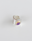 Reptilia silver earcuff with natural gemstone, serpent-inspired design detail.