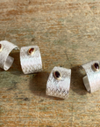 Reptilia silver earring with blue natural stone, side view of the cuff-like shape.