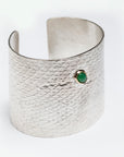 Close front view of the Reptilia Maxima silver cuff with green