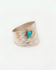 Reptilia silver ring with natural gemstone cabochon, front view on white.