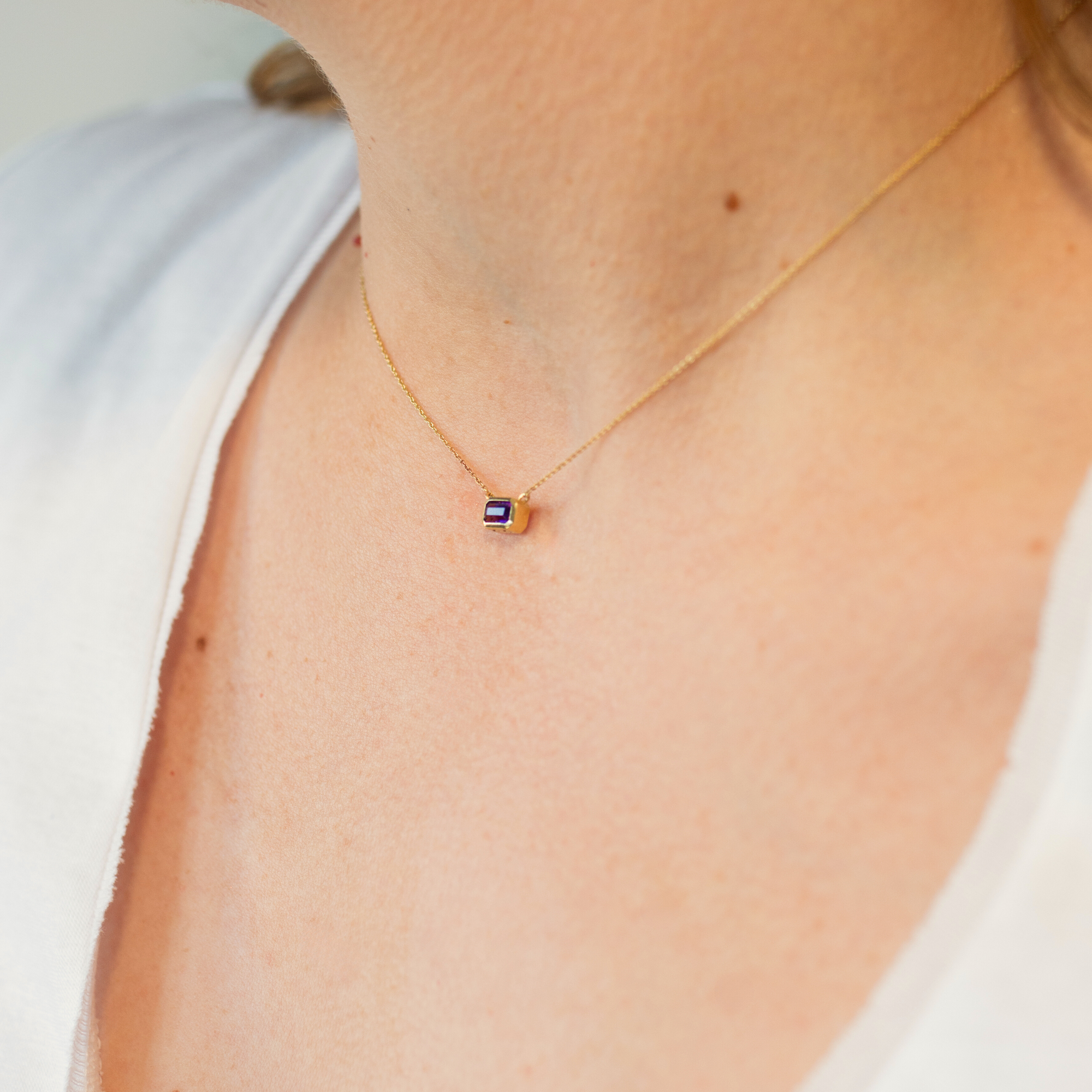 recycled-gold-heritage-pendant-birthstone-on-skin.png