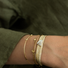 LES AMOURS Sfifa bracelet: Gold thread with sterling silver hearts.