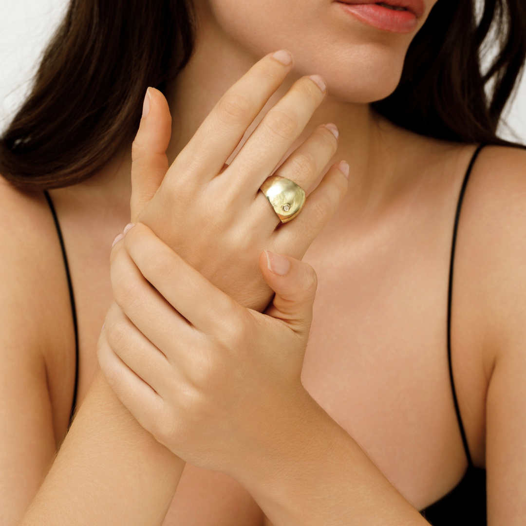 Bubble spark Ring in recycled gold with, worn on hand.