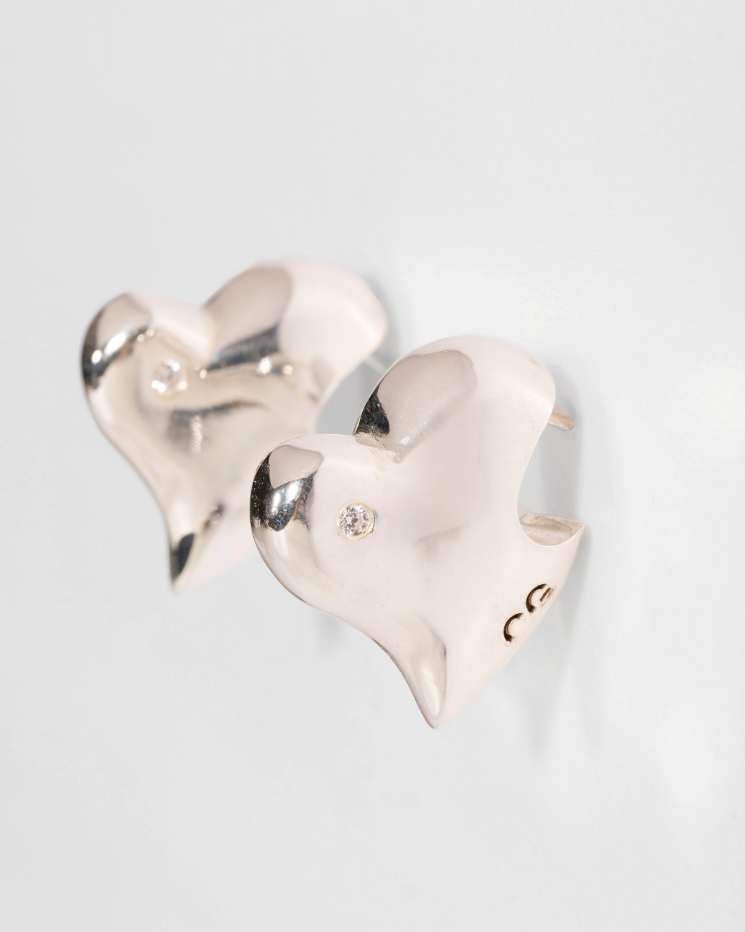 Bitten Heart earring crafted in recycled sterling silver by Carlota Guardia Jewelry