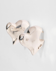 Bitten Heart earring crafted in recycled sterling silver by Carlota Guardia Jewelry