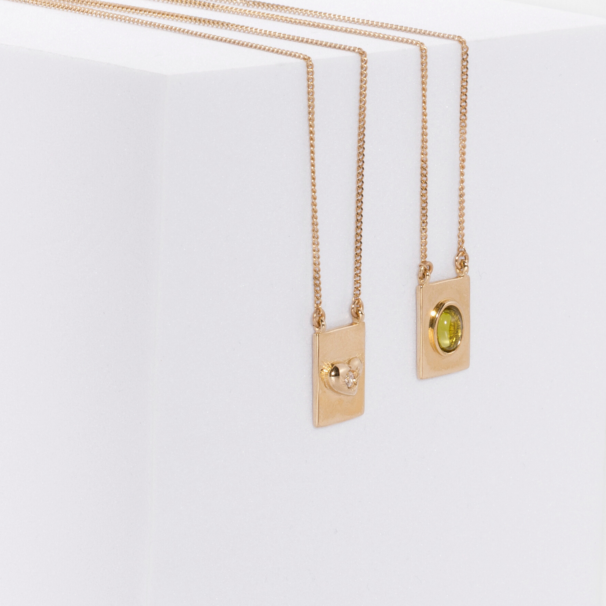 Grace scapular necklace by Carlota Guardia Jewelry from the Be Grateful collection, designed to support a daily gratitude ritual, crafted in recycled gold with natural peridot gemstone.