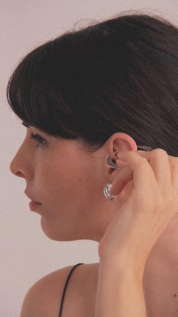 Halo Earrings in vermeil from the Reptilia collection worn by model, showcasing the organic and sculptural form