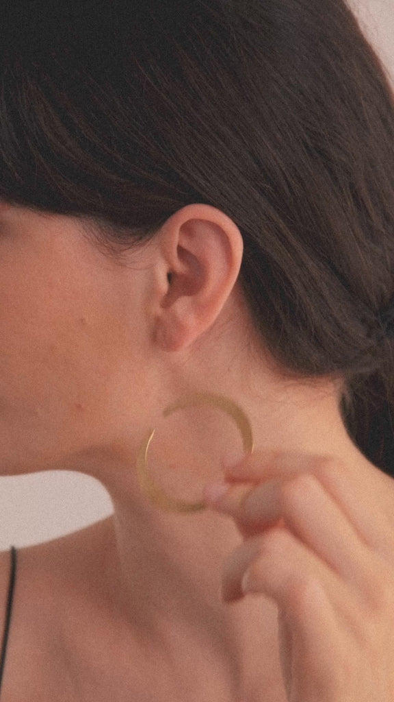 Halo Earrings in vermeil from the Reptilia collection worn by model, showcasing the organic and sculptural form