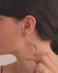 Halo Earrings in vermeil from the Reptilia collection worn by model, showcasing the organic and sculptural form